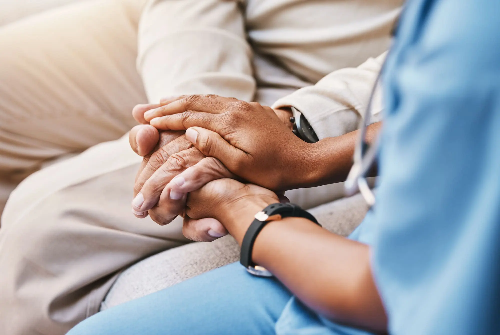 Nurse holding hands with patient in empathy, trust and support of help, advice and healthcare consulting. Kindness, counseling and medical therapy with doctor for hope, consultation and depression